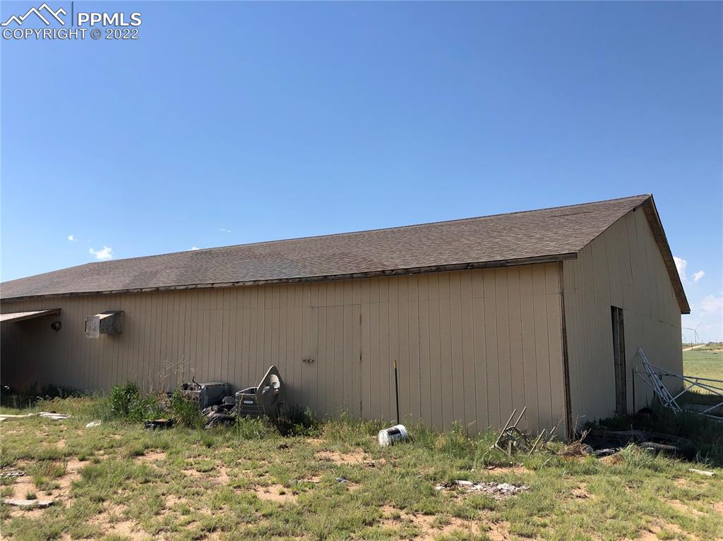4455 Yoder Road Yoder, CO 80864 - Photo 7 of 12 a backyard of a house