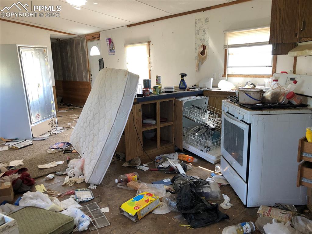 4455 Yoder Road Yoder, CO 80864 - Photo 10 of 12 a view of a kitchen with fridge and window