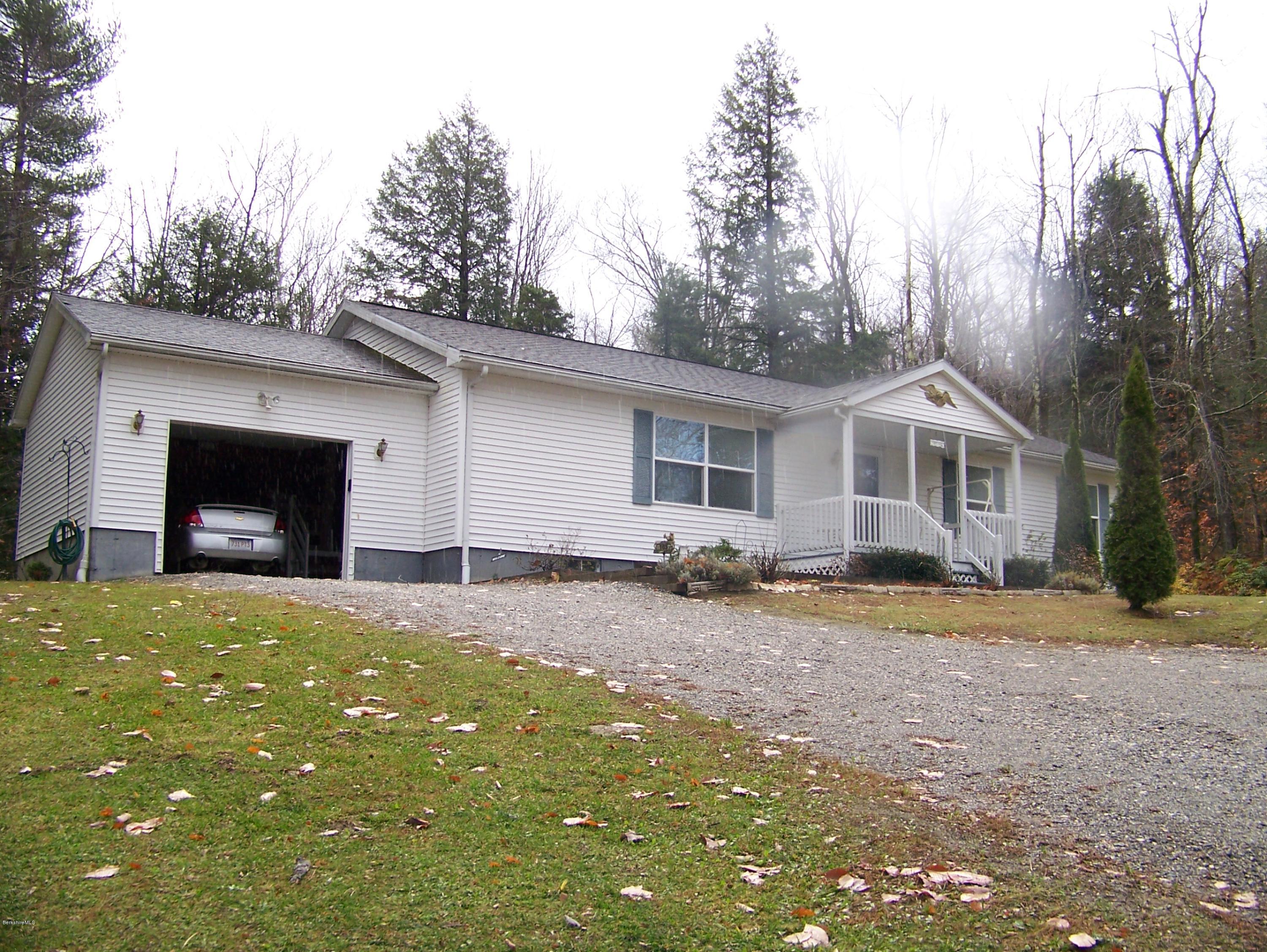 103 Algerie Road Becket, MA 01223 - Photo 4 of 37 a house view with a backyard space