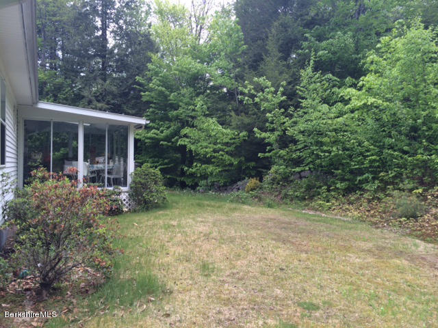 103 Algerie Road Becket, MA 01223 - Photo 7 of 37 a view of a house with a tree