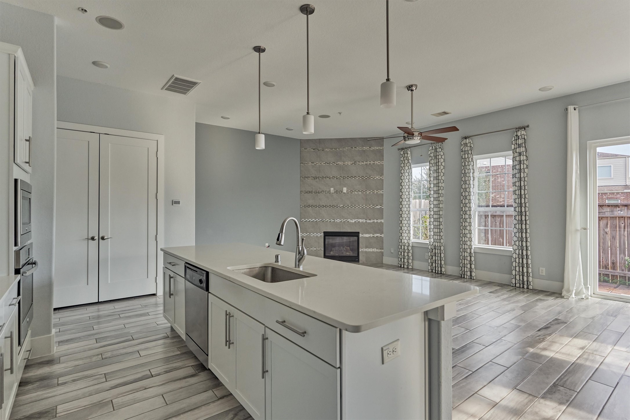 2113 Solstice Boulevard Spring, TX 77386 - Photo 22 of 48 a kitchen with a sink a counter space appliances and cabinets