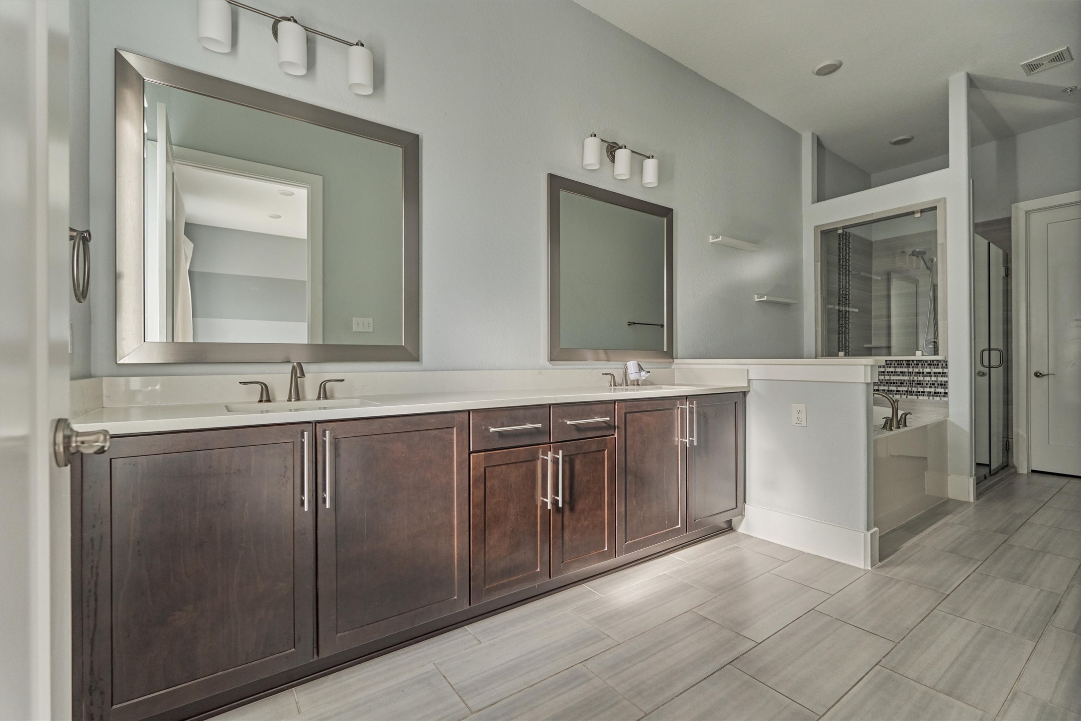 2113 Solstice Boulevard Spring, TX 77386 - Photo 26 of 48 a bathroom with a double vanity sink mirror and