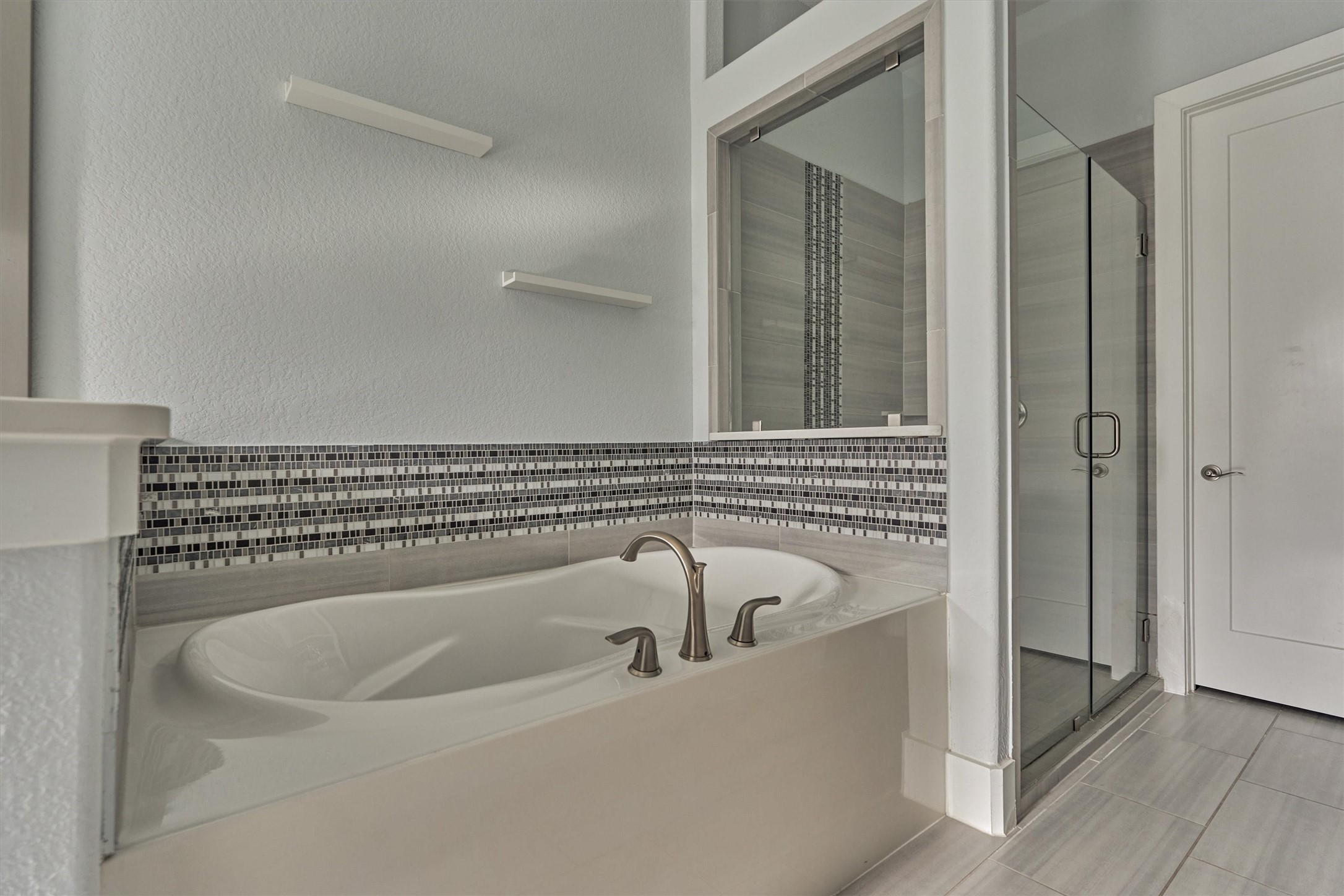 2113 Solstice Boulevard Spring, TX 77386 - Photo 28 of 48 a bathroom with a bathtub