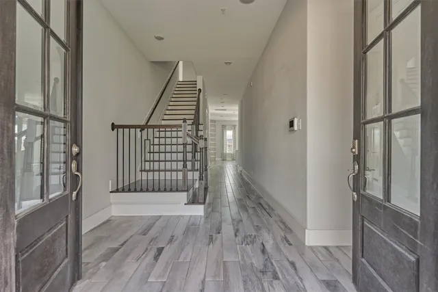 a view of an entryway with wooden floor