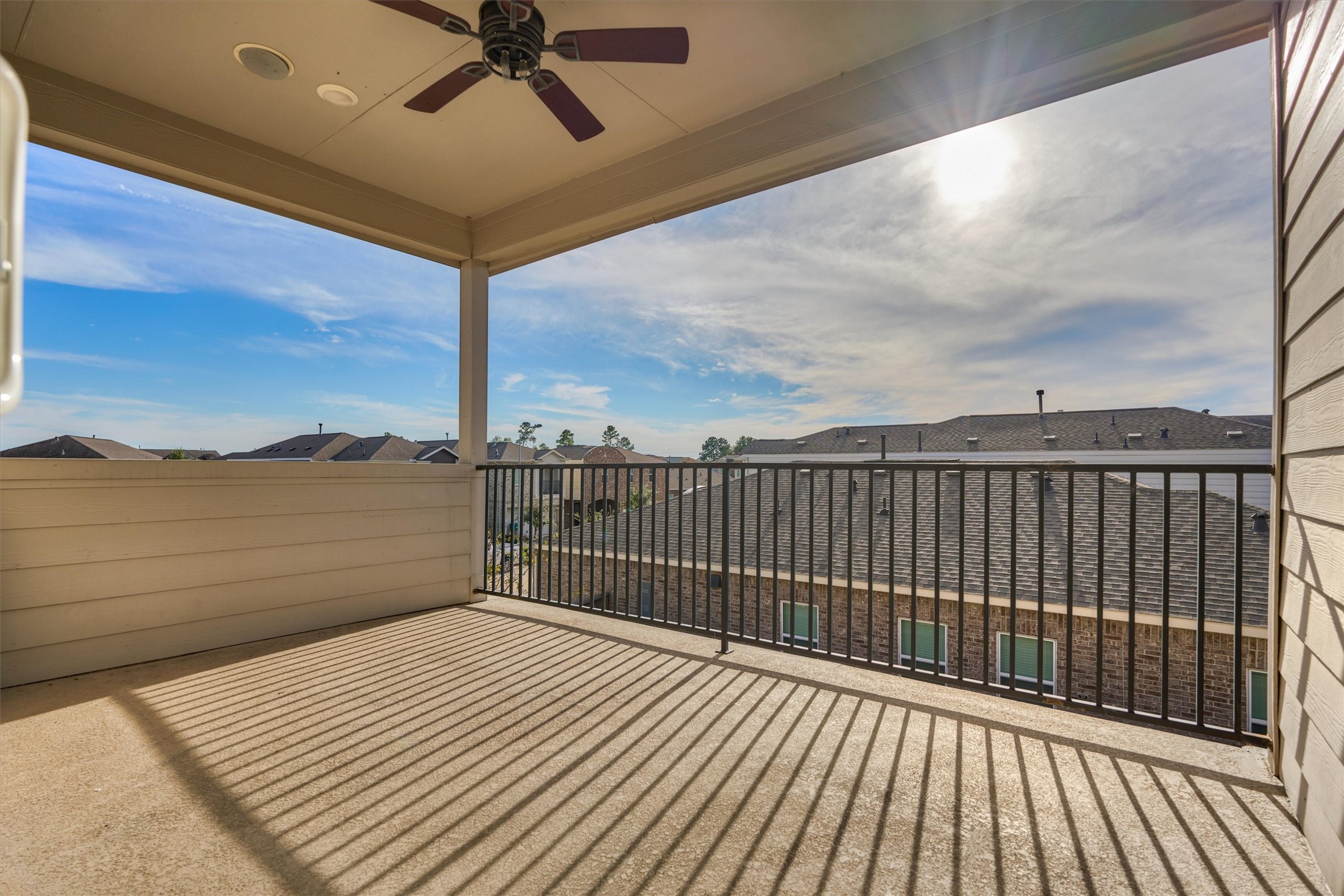 2113 Solstice Boulevard Spring, TX 77386 - Photo 33 of 48 a view of a balcony with wooden floor and city view