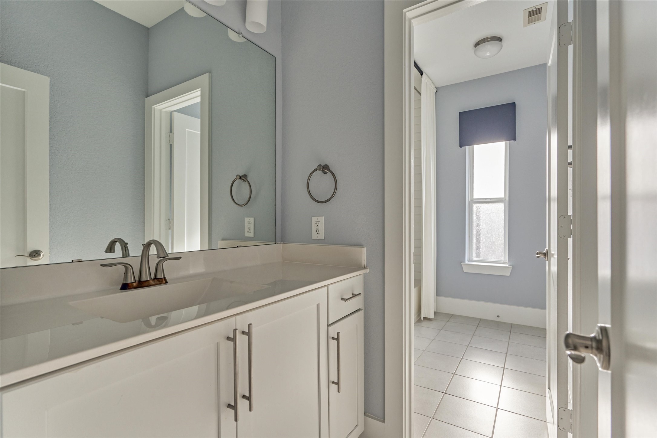 2113 Solstice Boulevard Spring, TX 77386 - Photo 38 of 48 a bathroom with a granite countertop sink a mirror and a