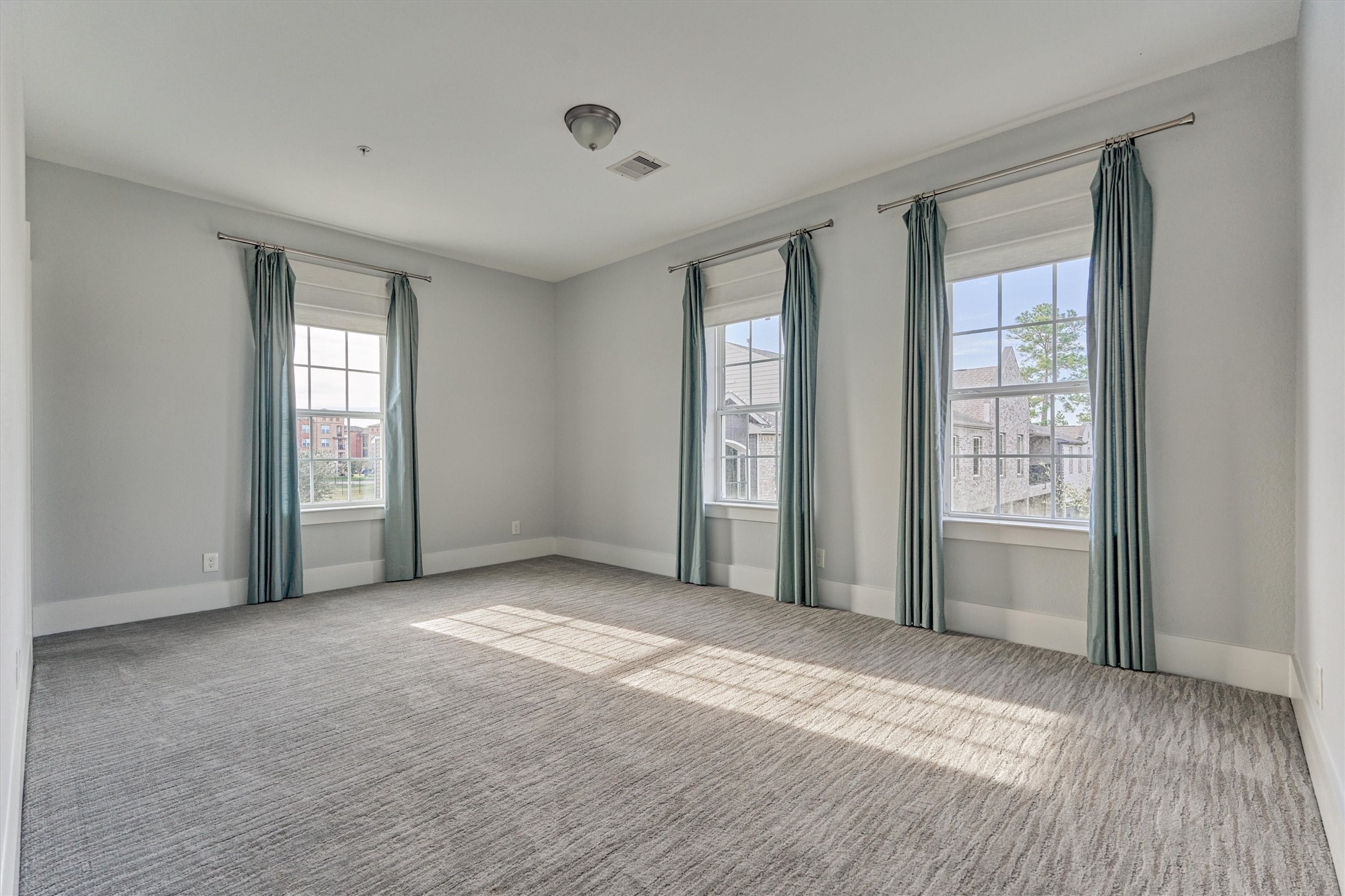 2113 Solstice Boulevard Spring, TX 77386 - Photo 40 of 48 a view of an empty room with a window and wooden floor