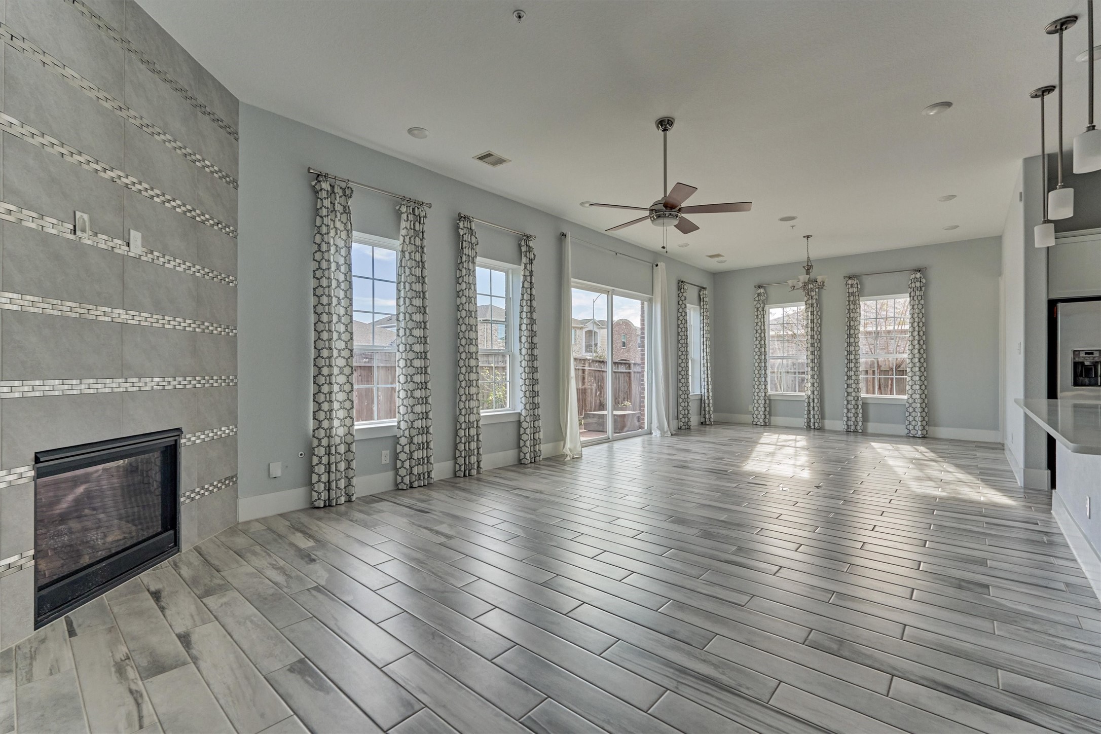 2113 Solstice Boulevard Spring, TX 77386 - Photo 9 of 48 an empty room with wooden floor and a fireplace
