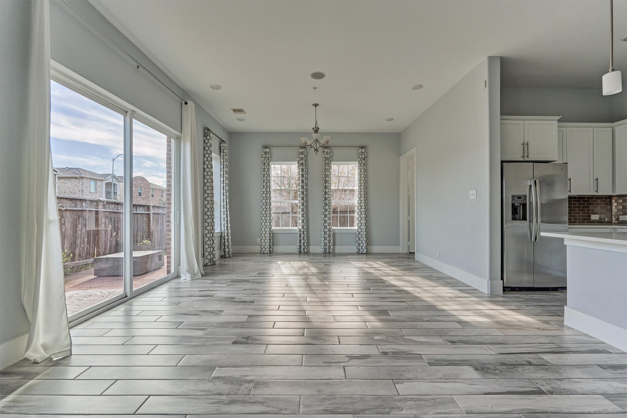 2113 Solstice Boulevard Spring, TX 77386 - Photo 10 of 48 a view of empty room with wooden floor and fan