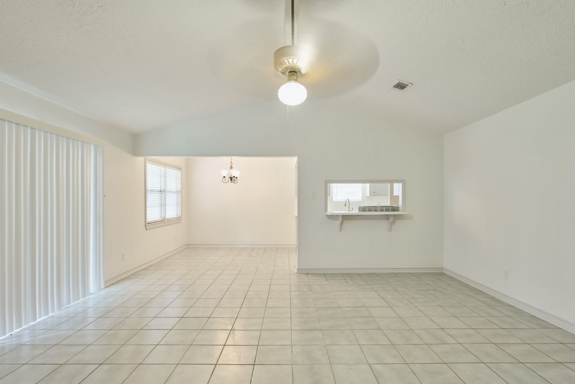 619 Pinewood Drive Conroe, TX 77385 - Photo 14 of 44 an empty room with windows and entrance
