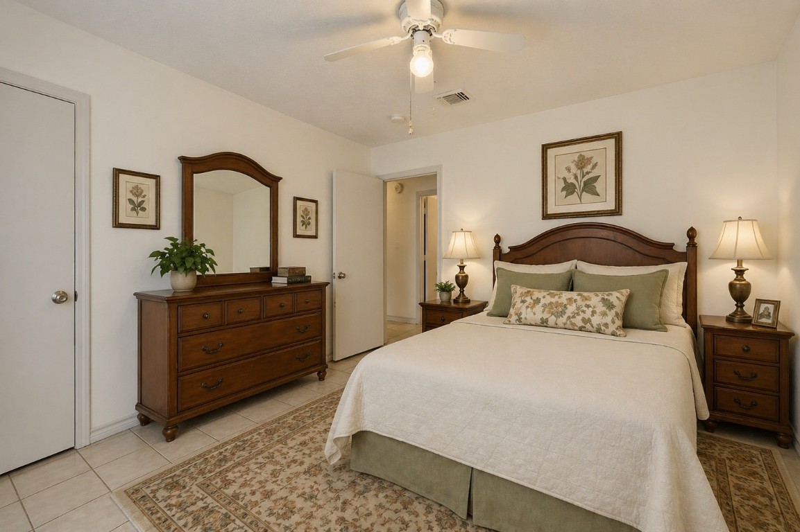 619 Pinewood Drive Conroe, TX 77385 - Photo 25 of 44 a bedroom with a bed and a dresser