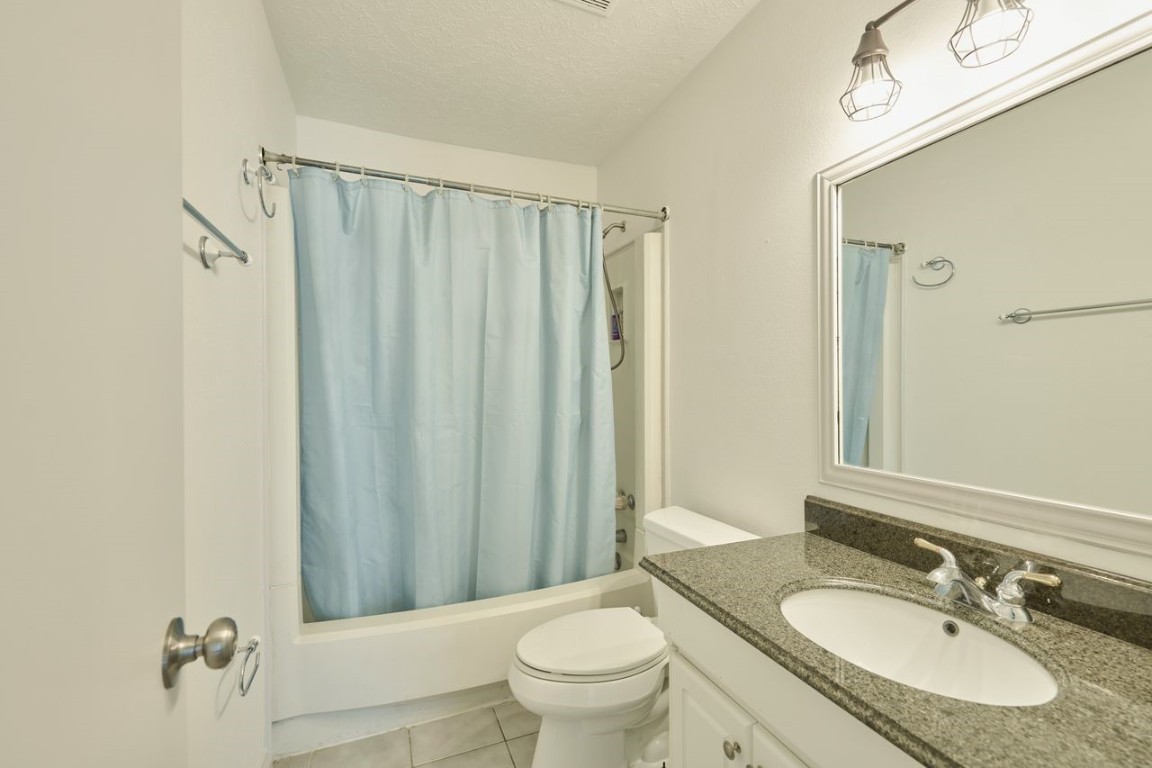 619 Pinewood Drive Conroe, TX 77385 - Photo 27 of 44 a bathroom with a sink toilet and shower