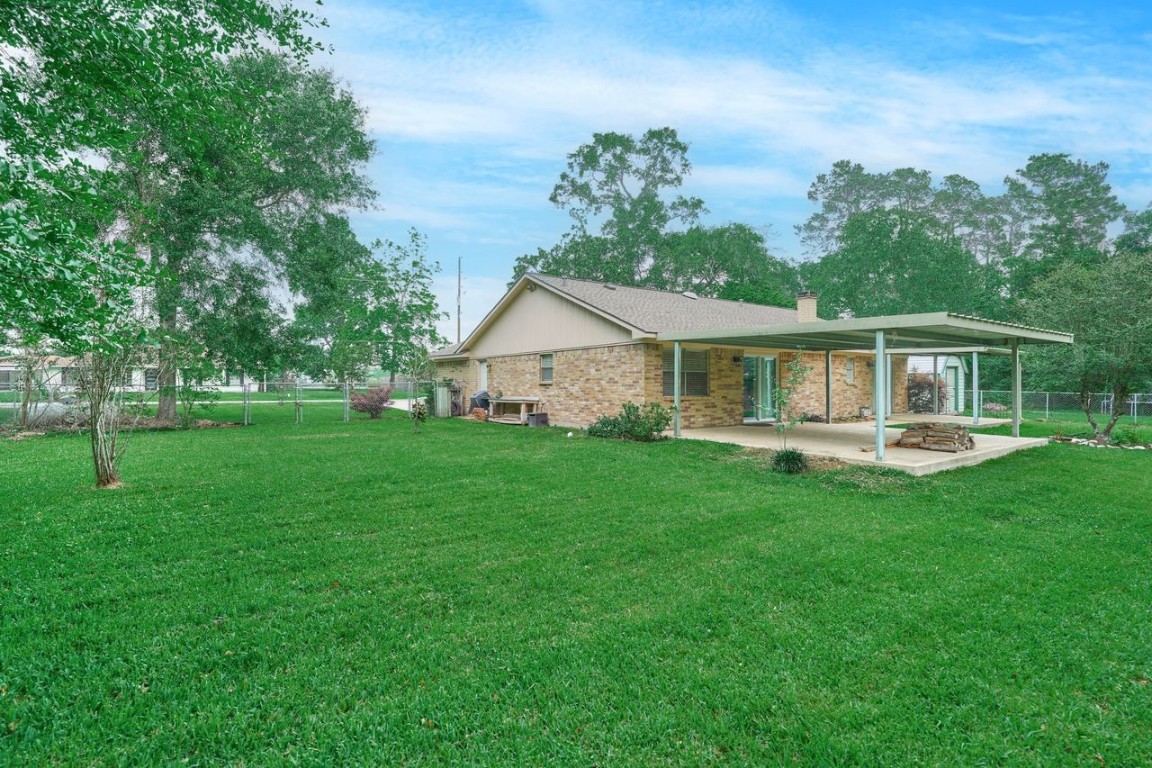 619 Pinewood Drive Conroe, TX 77385 - Photo 35 of 44 a view of an house that has garden