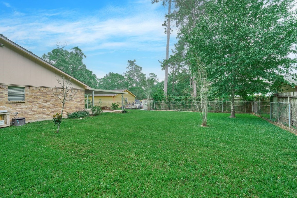 619 Pinewood Drive Conroe, TX 77385 - Photo 36 of 44 a view of a back yard