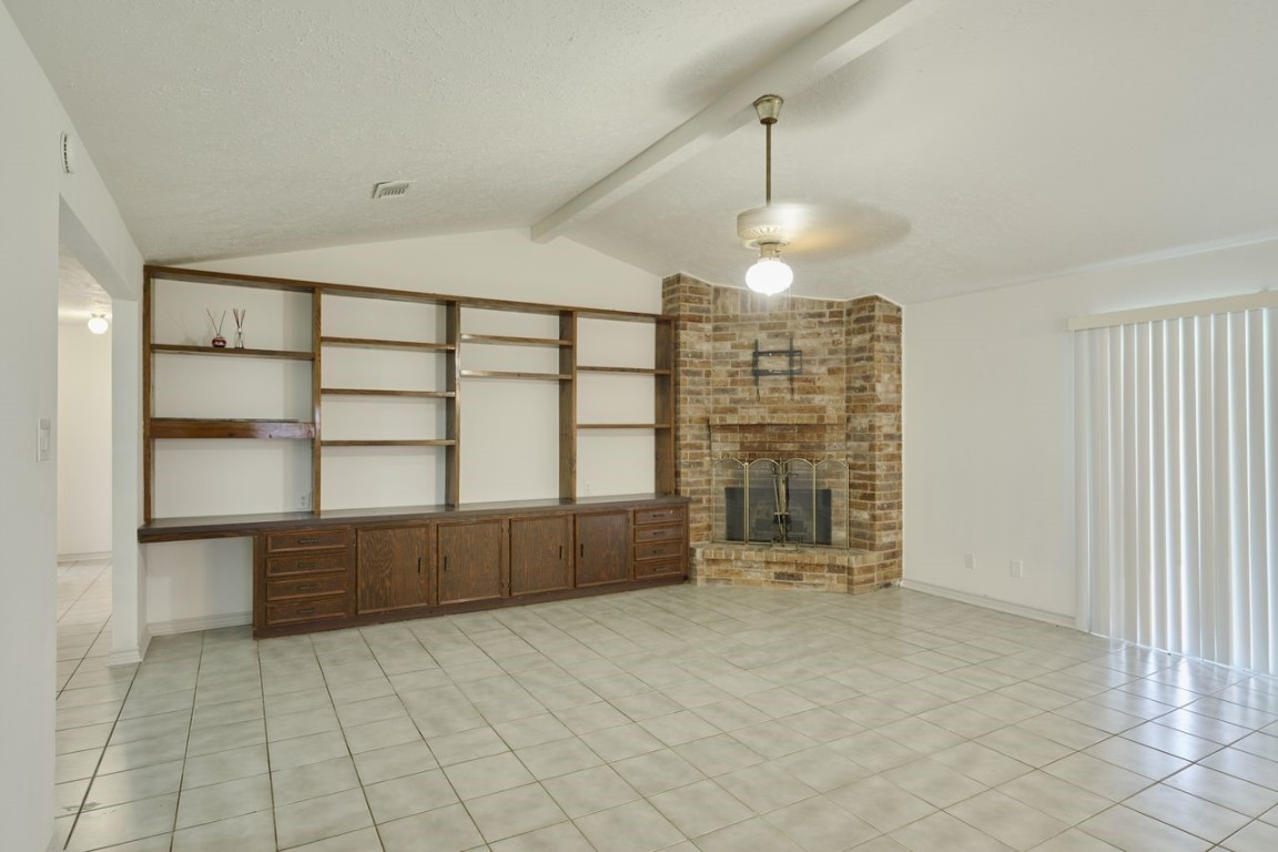 619 Pinewood Drive Conroe, TX 77385 - Photo 9 of 44 a view of an empty room with a window