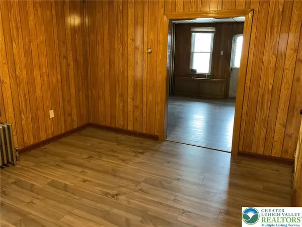 a view of entryway with wooden floor