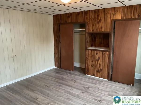 a view of a storage & utility room with wooden floor