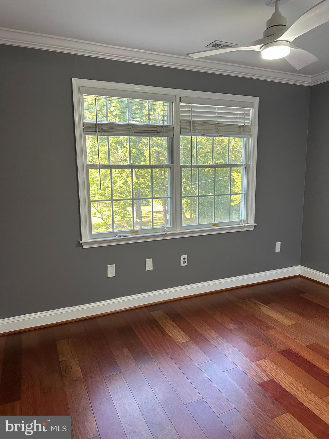 324 Jennings Road Severna Park, MD 21146 - Photo 14 of 28 a view of an empty room with wooden floor and a window