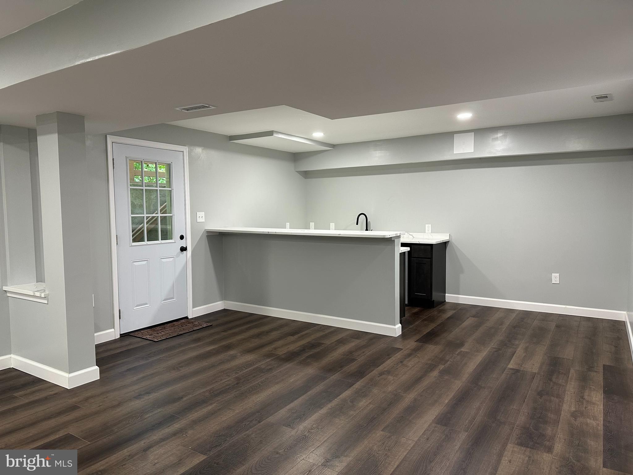 324 Jennings Road Severna Park, MD 21146 - Photo 23 of 28 a view of a kitchen with wooden floor and staircase