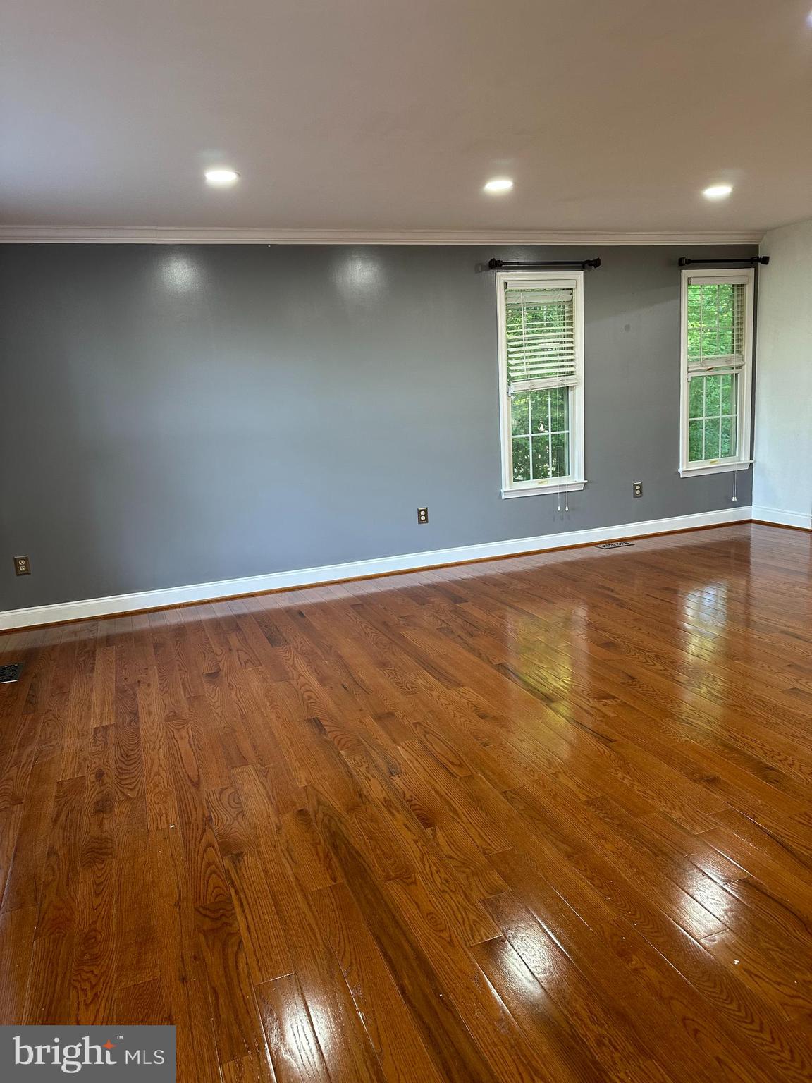 324 Jennings Road Severna Park, MD 21146 - Photo 3 of 28 an empty room with wooden floor and windows