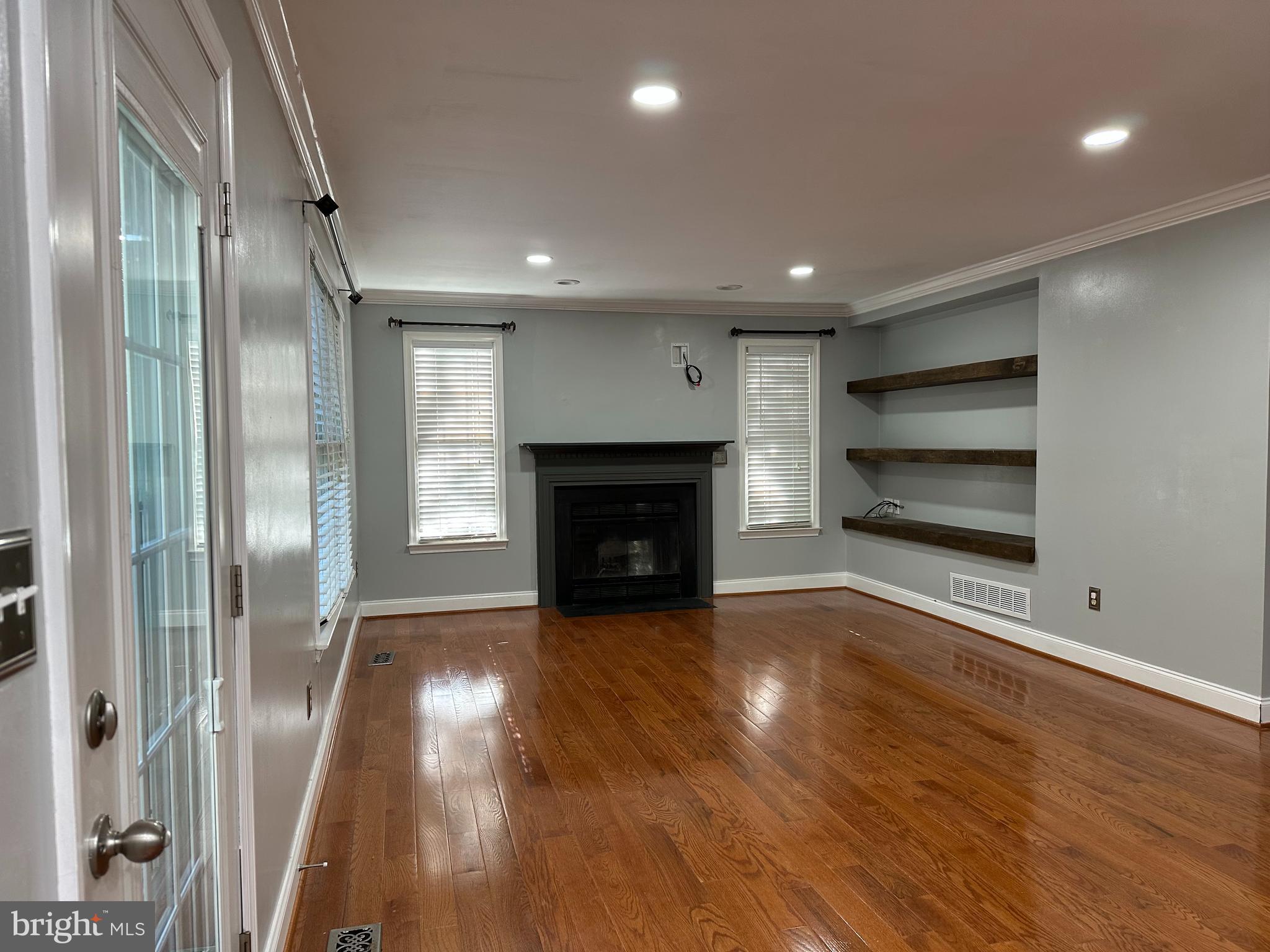 324 Jennings Road Severna Park, MD 21146 - Photo 5 of 28 a view of a livingroom with a fireplace wooden floor and window