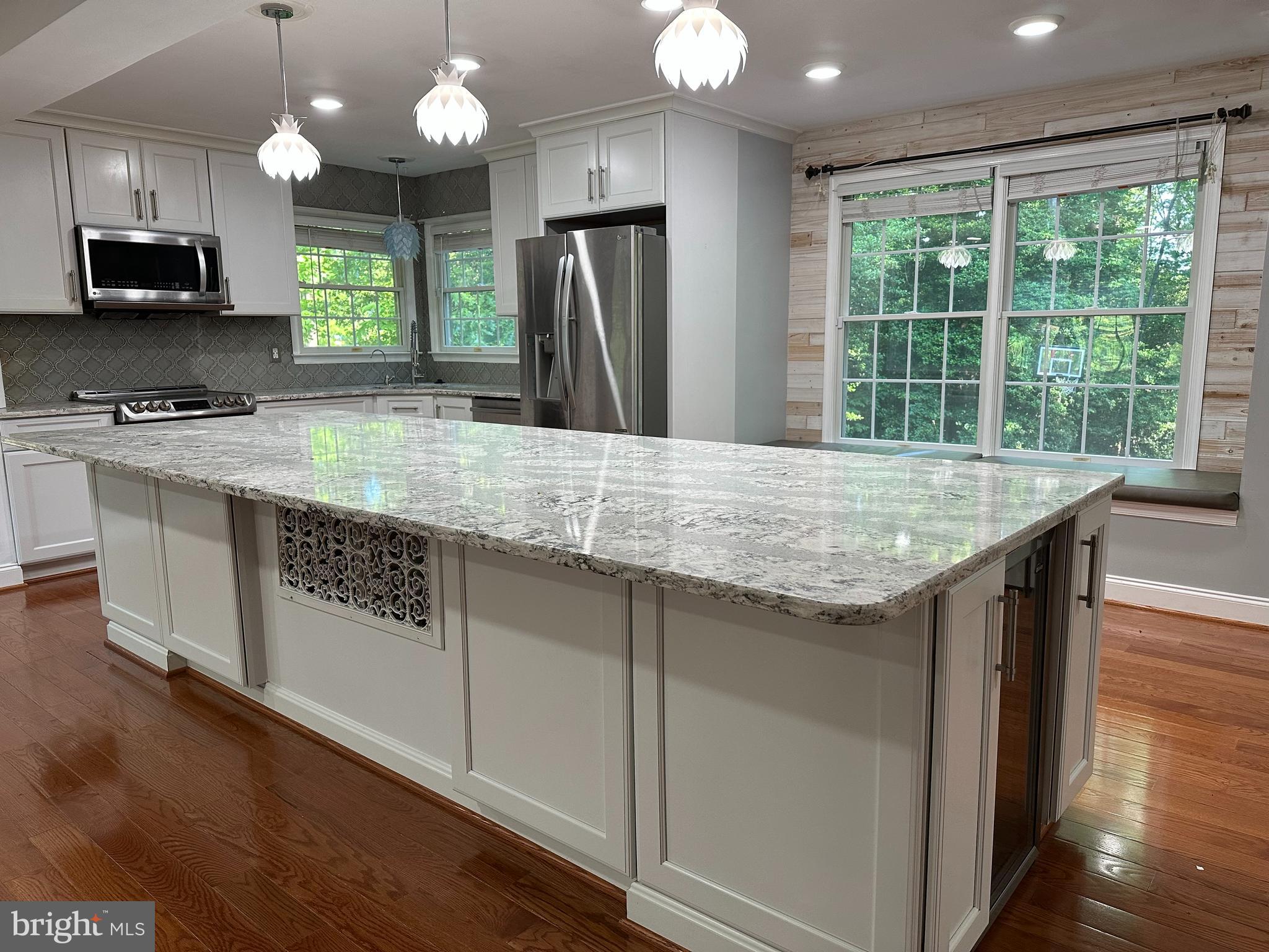 324 Jennings Road Severna Park, MD 21146 - Photo 8 of 28 a kitchen with stainless steel appliances granite countertop a stove a sink a refrigerator and a microwave