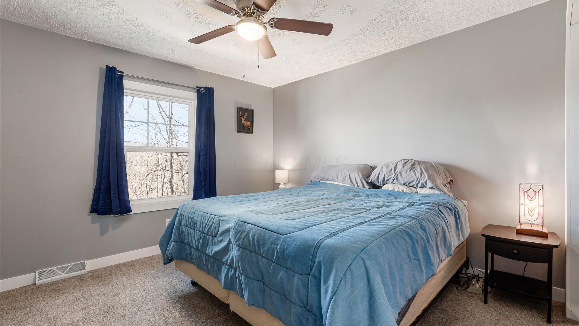 10050 Perryton Road Frazeysburg, OH 43822 - Photo 17 of 47 Primary bedroom