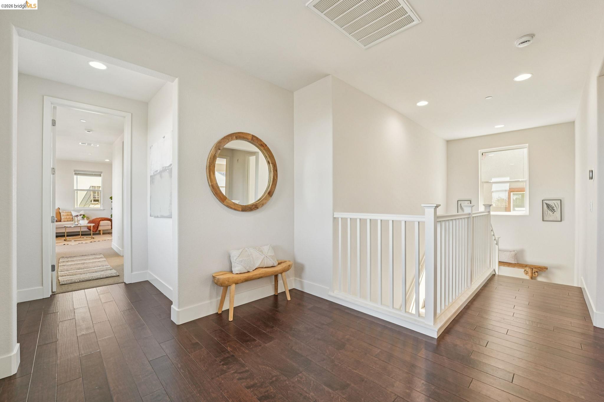 2770 Bette Street Alameda, CA 94501 - Photo 23 of 60 a view of a hallway with wooden floor and a bathroom