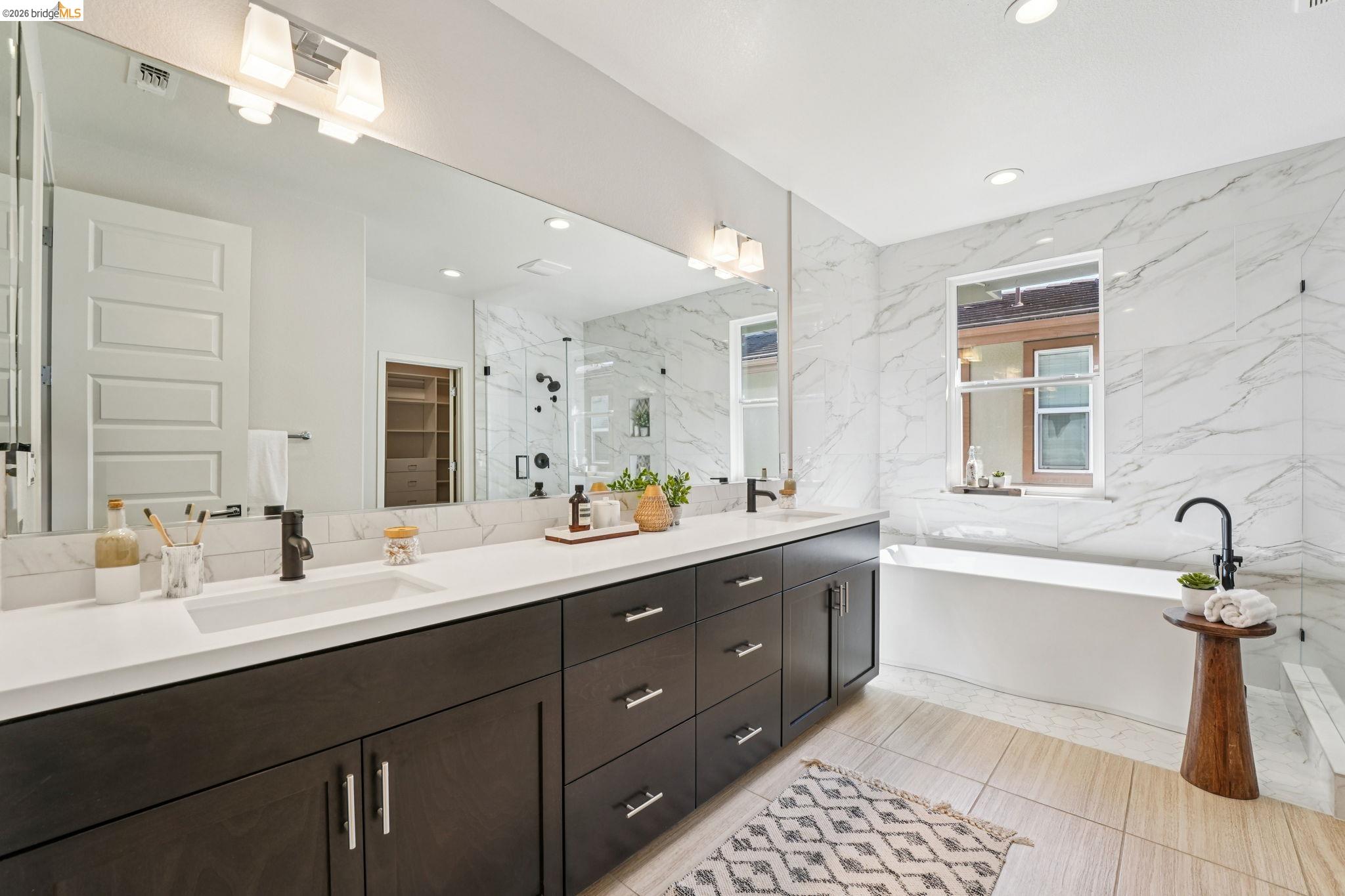 2770 Bette Street Alameda, CA 94501 - Photo 32 of 60 a bathroom with a tub sink double vanity granite and a mirror