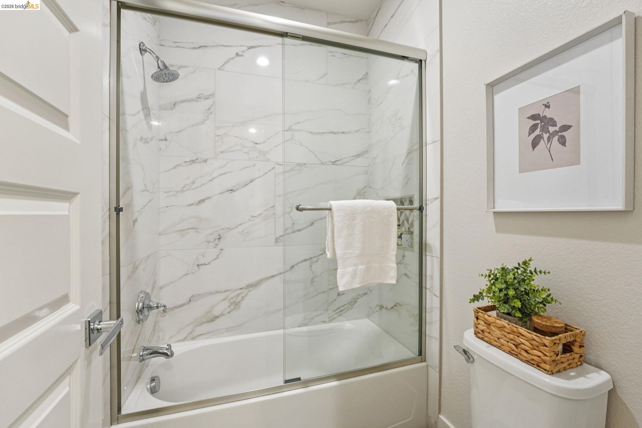 2770 Bette Street Alameda, CA 94501 - Photo 39 of 60 a bath tub sitting next to a white sink and vanity
