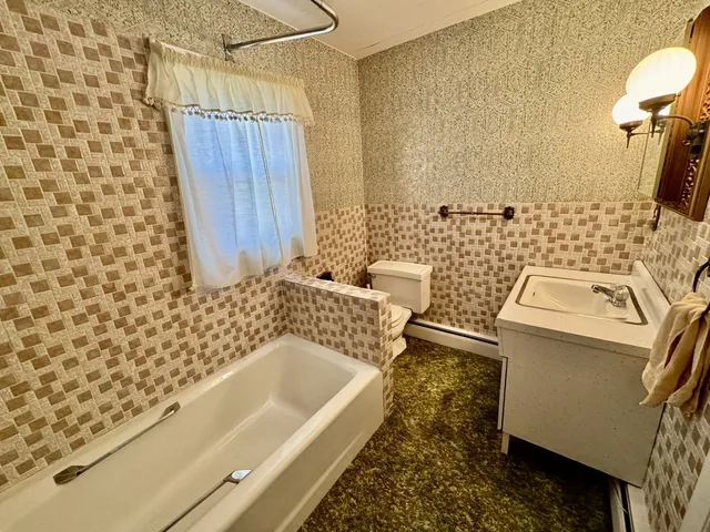 a bathroom with a bathtub and shower