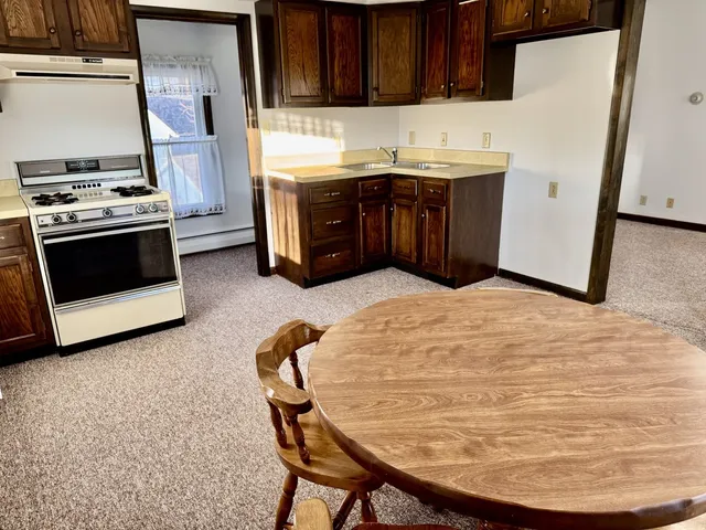 a kitchen with a stove and a refrigerator