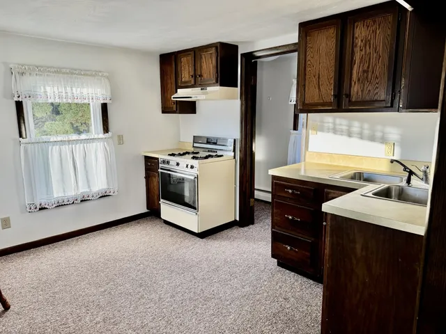 a kitchen with a stove and a refrigerator