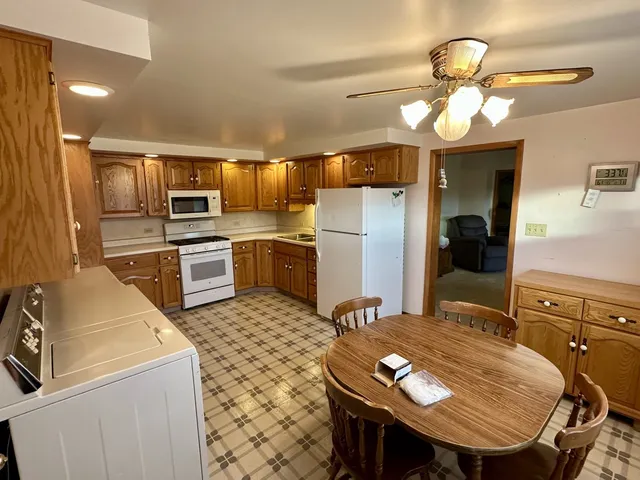 a kitchen with refrigerator cabinets and furniture