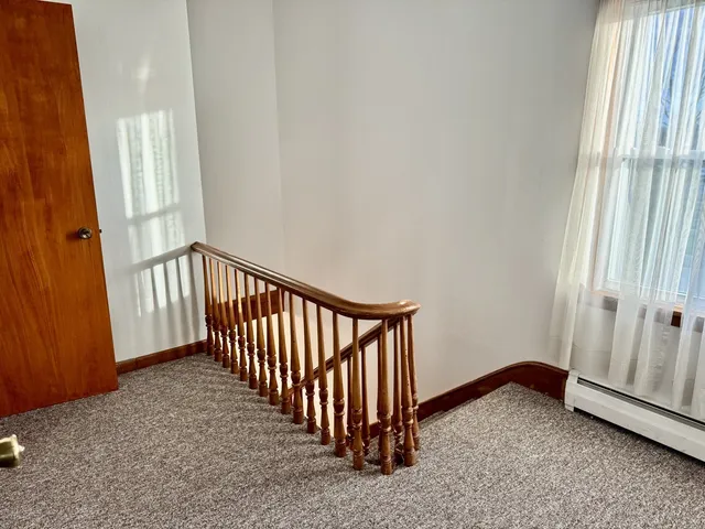 a view of a hallway with a window