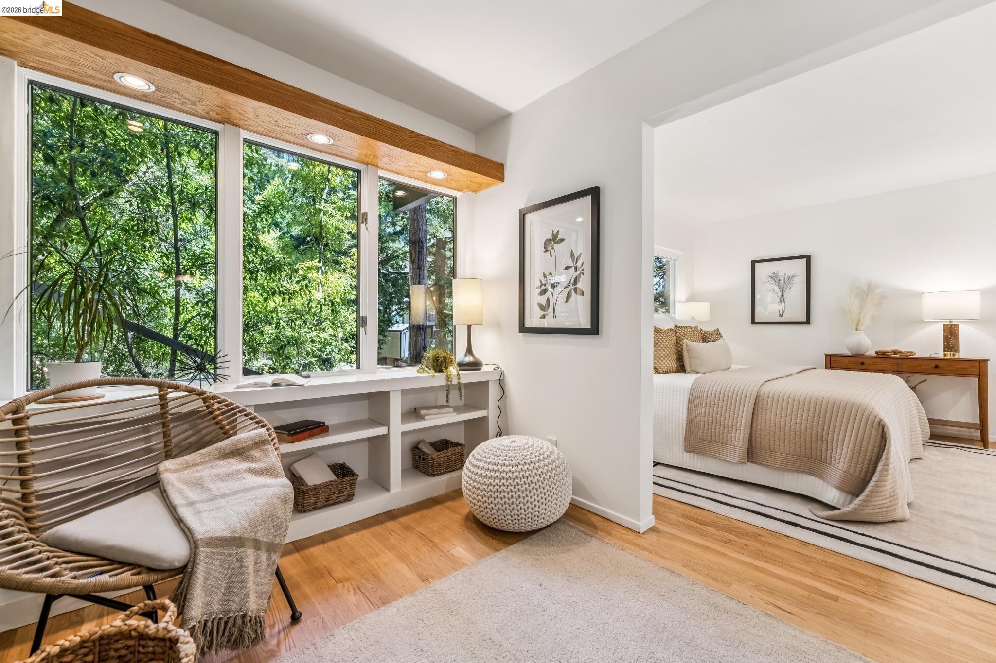 6645 Heather Ridge Way Oakland, CA 94611 - Photo 24 of 61 Expansive window wall with natural wood trim, recessed lighting, and integrated shelving