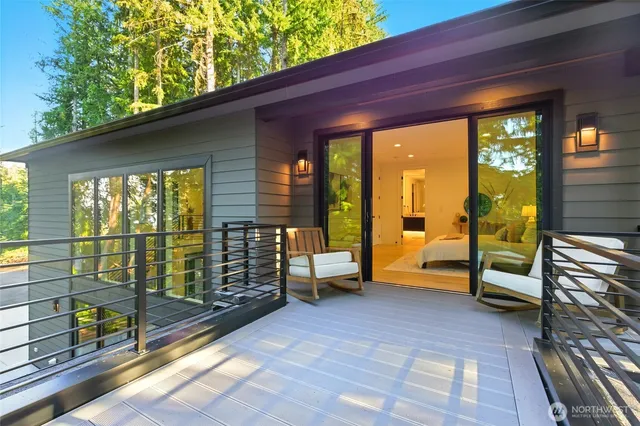 a view of a balcony with table and chairs