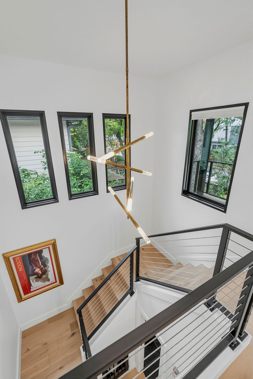 2004 Riverview Street Austin, TX 78702 - Photo 15 of 36 Staircase with cable railing and wood-finish treads