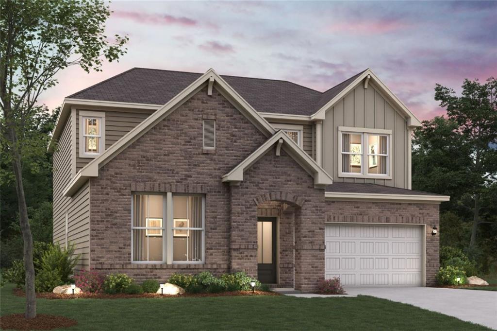 981 Kingsley Way Lithonia, GA 30058 - Photo 1 of 1 a front view of a house with a yard and garage