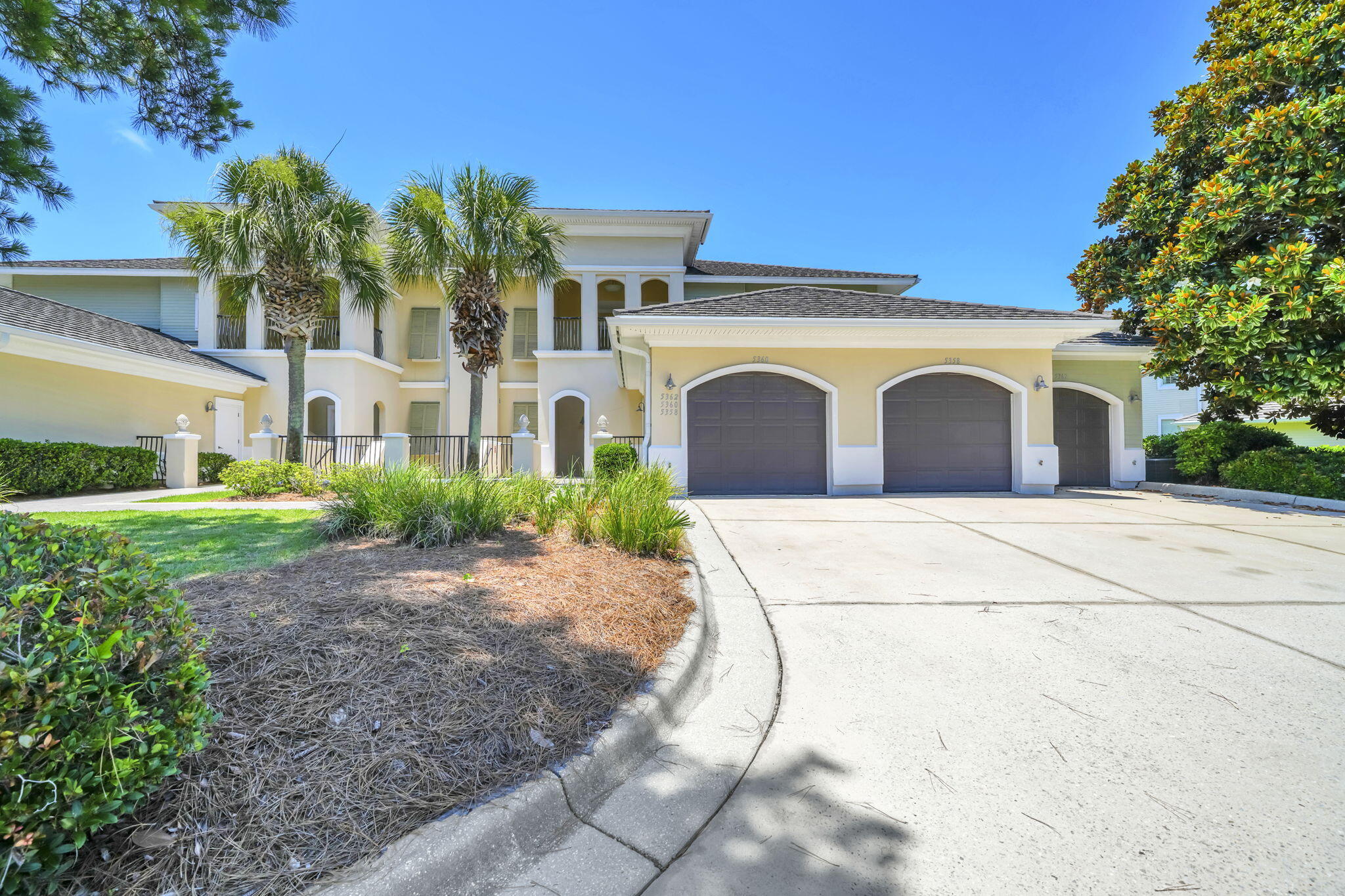 5360 Pine Ridge Lane, Unit 5360 Miramar Beach, FL 32550 - Photo 41 of 44 a view of a white house with a yard