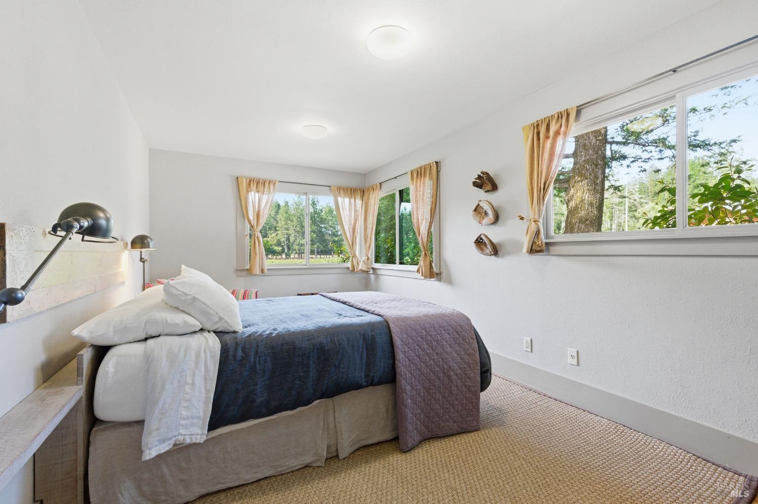 425 Cold Springs Road Angwin, CA 94508 - Photo 18 of 53 a bedroom with a bed and a window