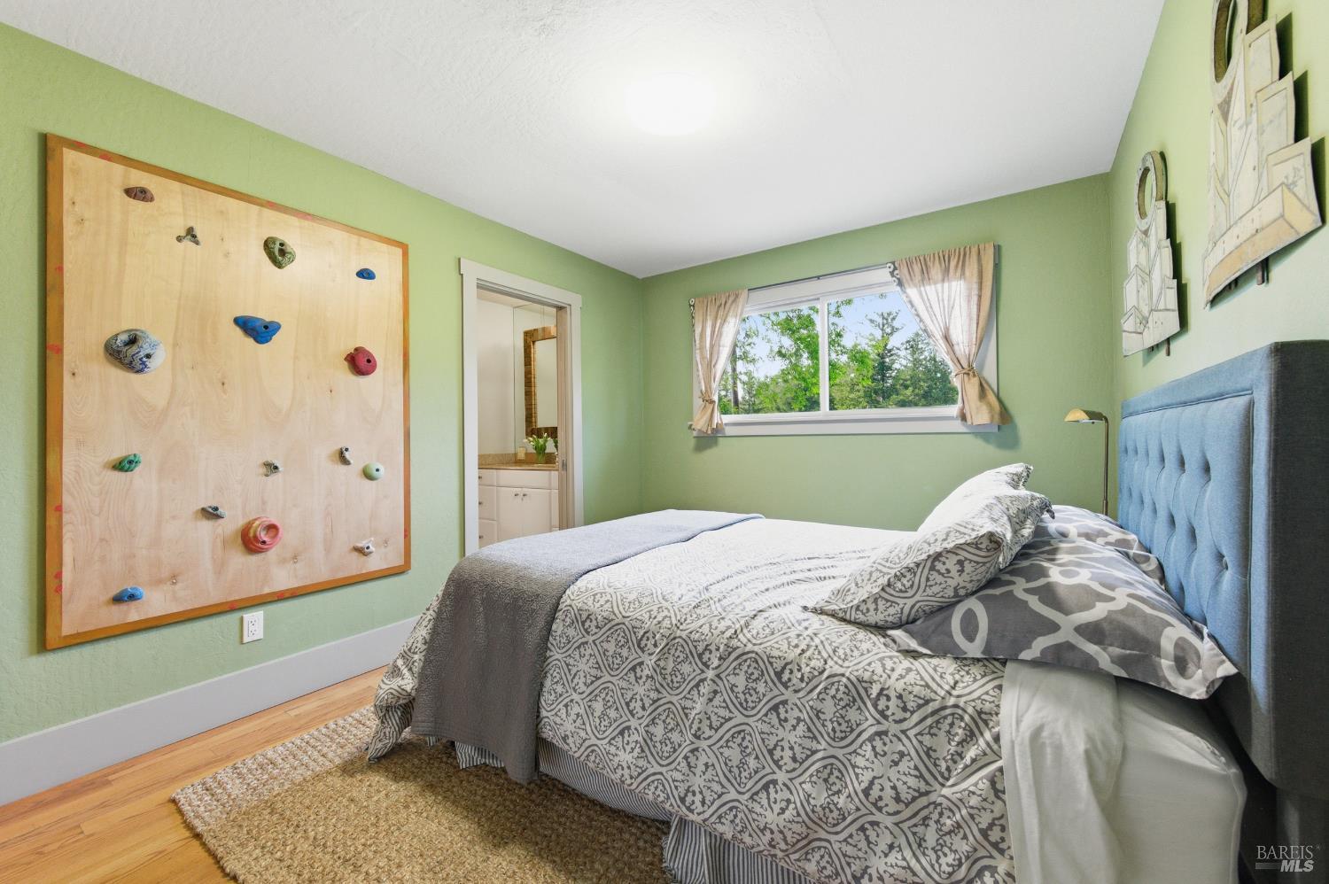 425 Cold Springs Road Angwin, CA 94508 - Photo 20 of 53 a bedroom with a bed and a window with painted walls