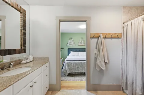 a bedroom with a bed and a couch