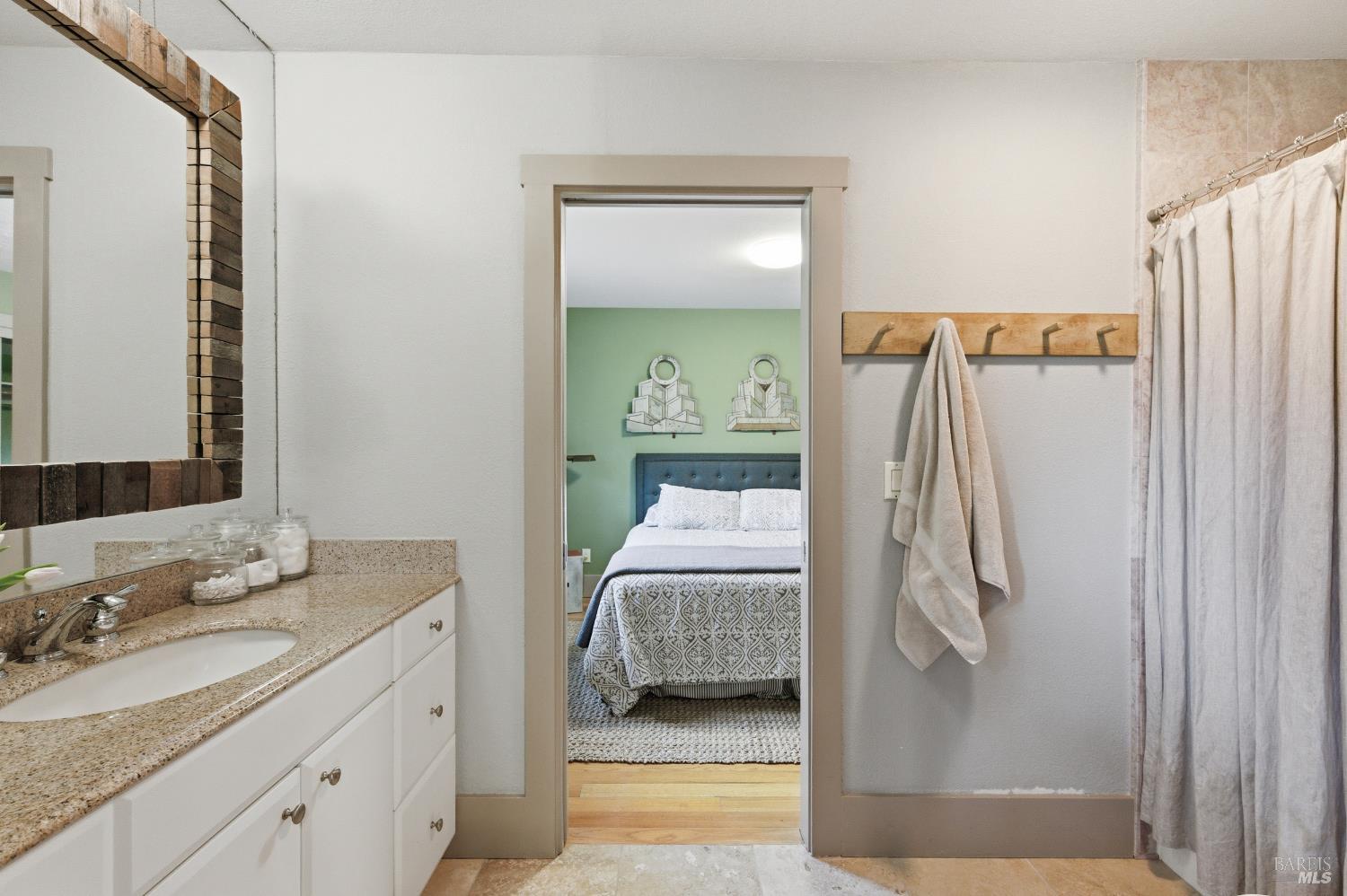 425 Cold Springs Road Angwin, CA 94508 - Photo 22 of 53 a en suite bathroom with a double vanity sink and mirror