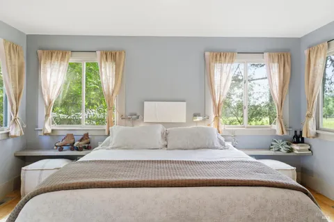 a living room with a couch and a large window