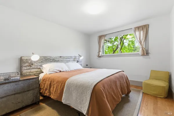 a spacious bedroom with a large bed and a couch