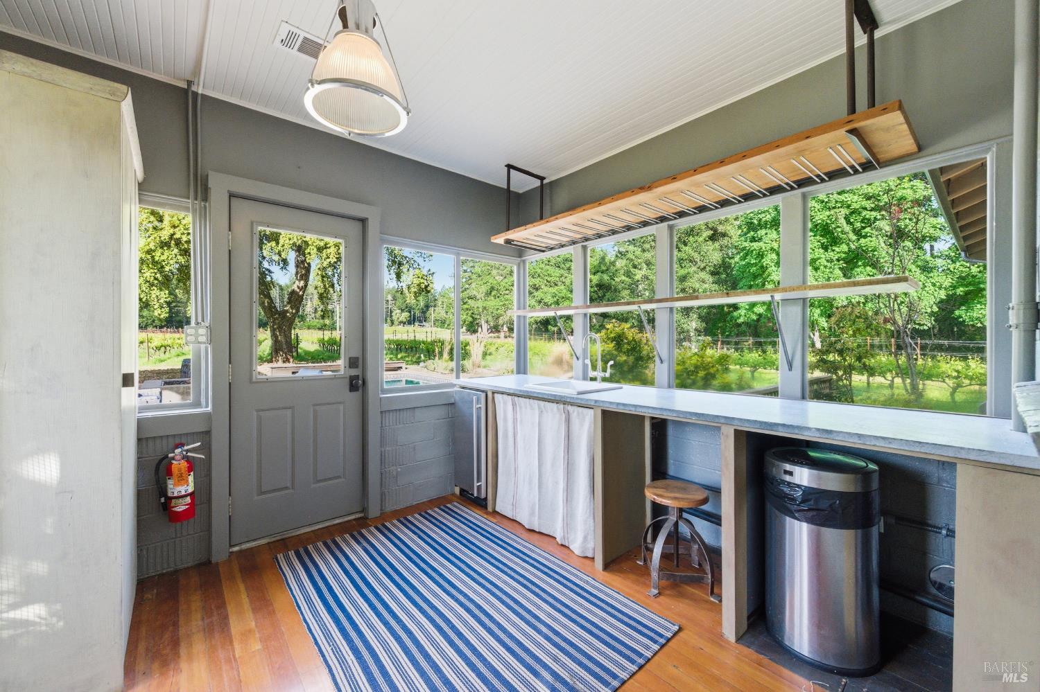 425 Cold Springs Road Angwin, CA 94508 - Photo 38 of 53 a kitchen with wooden floors and white walls