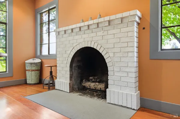 a kitchen with stainless steel appliances granite countertop a stove and a wooden floors