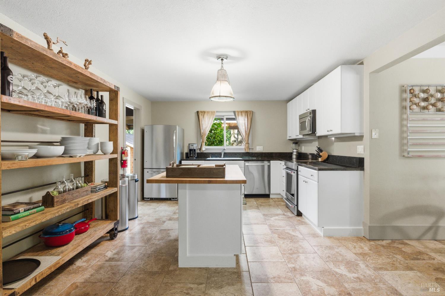 425 Cold Springs Road Angwin, CA 94508 - Photo 10 of 53 a kitchen with stainless steel appliances kitchen island granite countertop a sink and cabinets