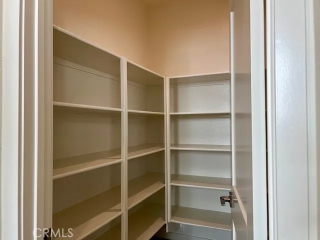 a white toilet sitting next to a white sink
